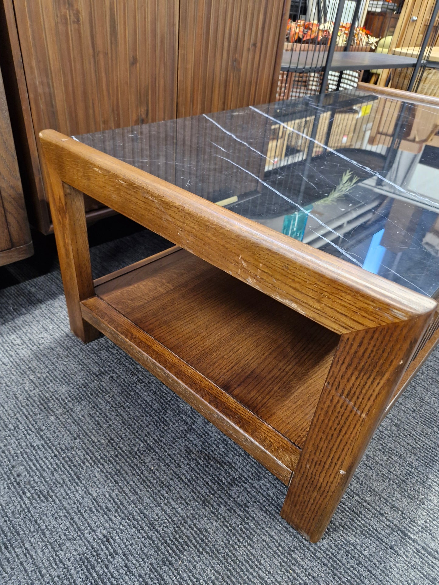 Dark wood and black marble coffee table with storage