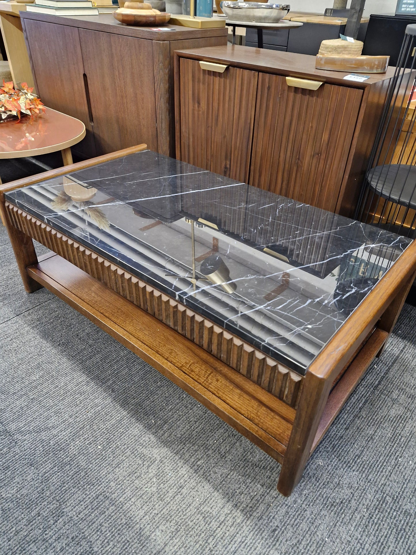 Dark wood and black marble coffee table with storage
