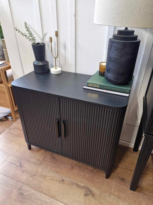 Small Black Sideboard with ribbed doors and rounded corners