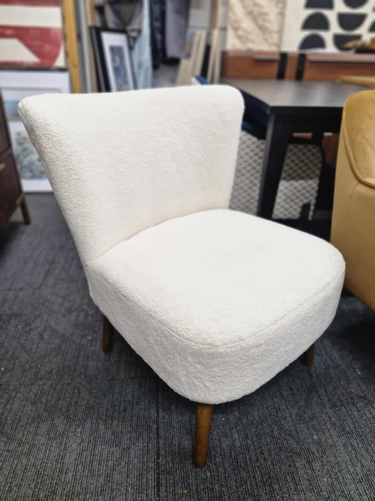 White Boucle chair with dark wood legs