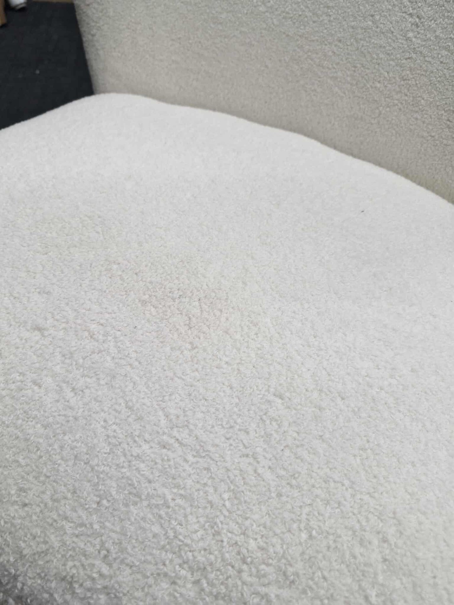 White Boucle chair with dark wood legs