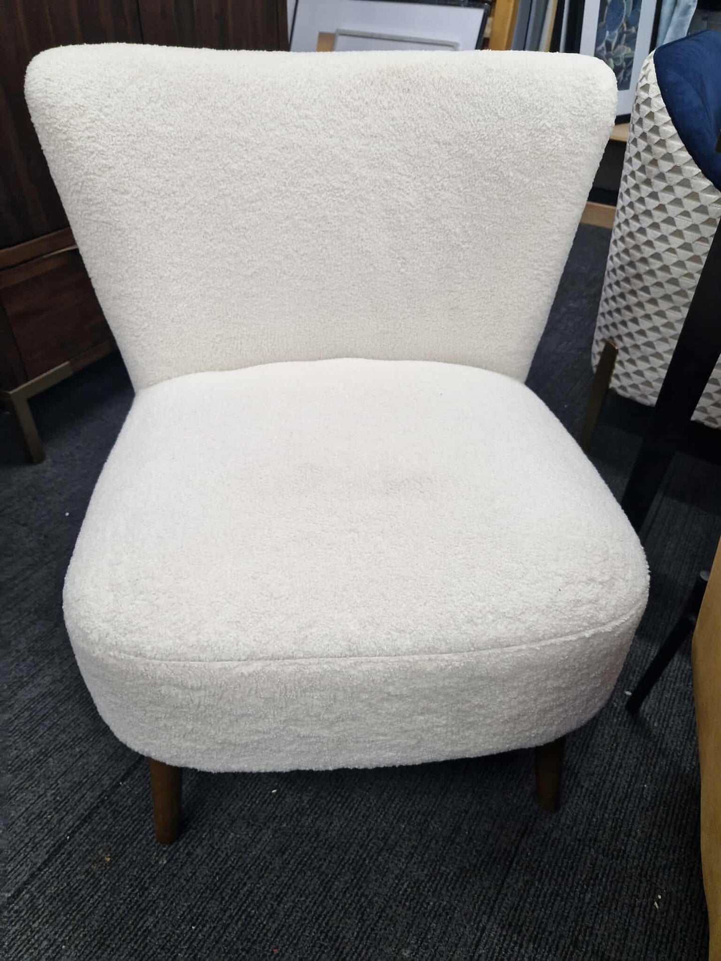 White Boucle chair with dark wood legs