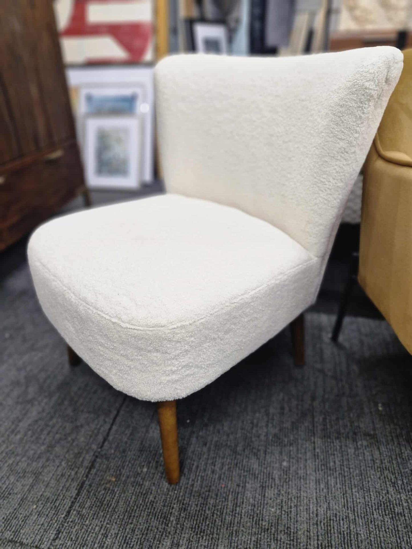White Boucle chair with dark wood legs