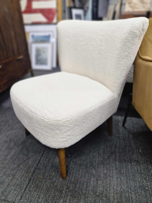 White Boucle chair with dark wood legs