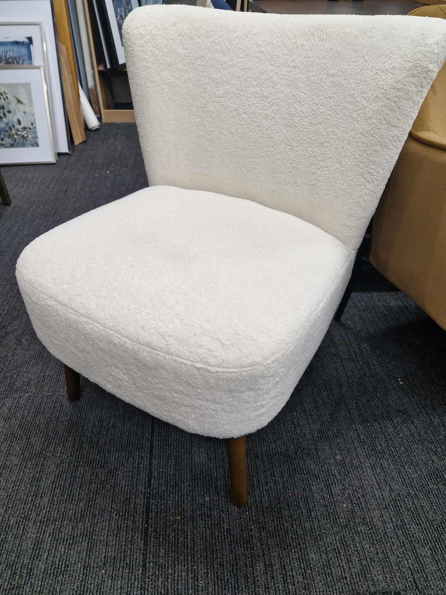 White Boucle chair with dark wood legs