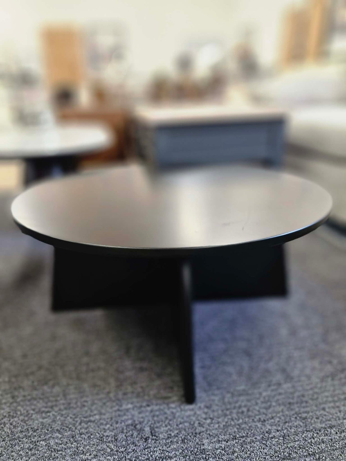 Black Round Coffee Table with Curved Base