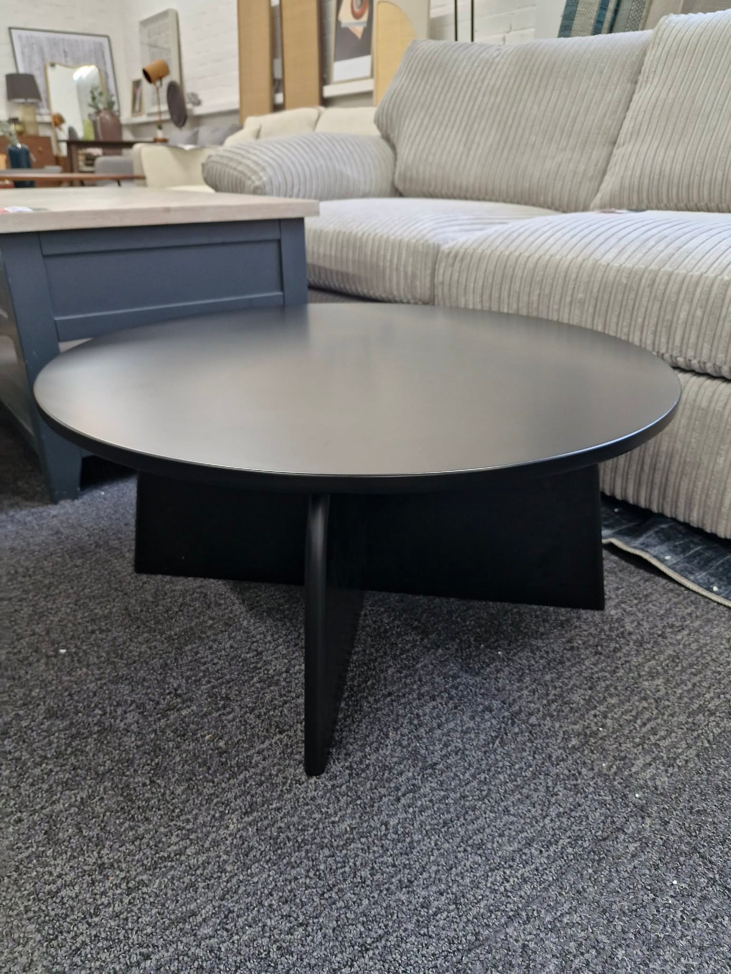 Black Round Coffee Table with Curved Base