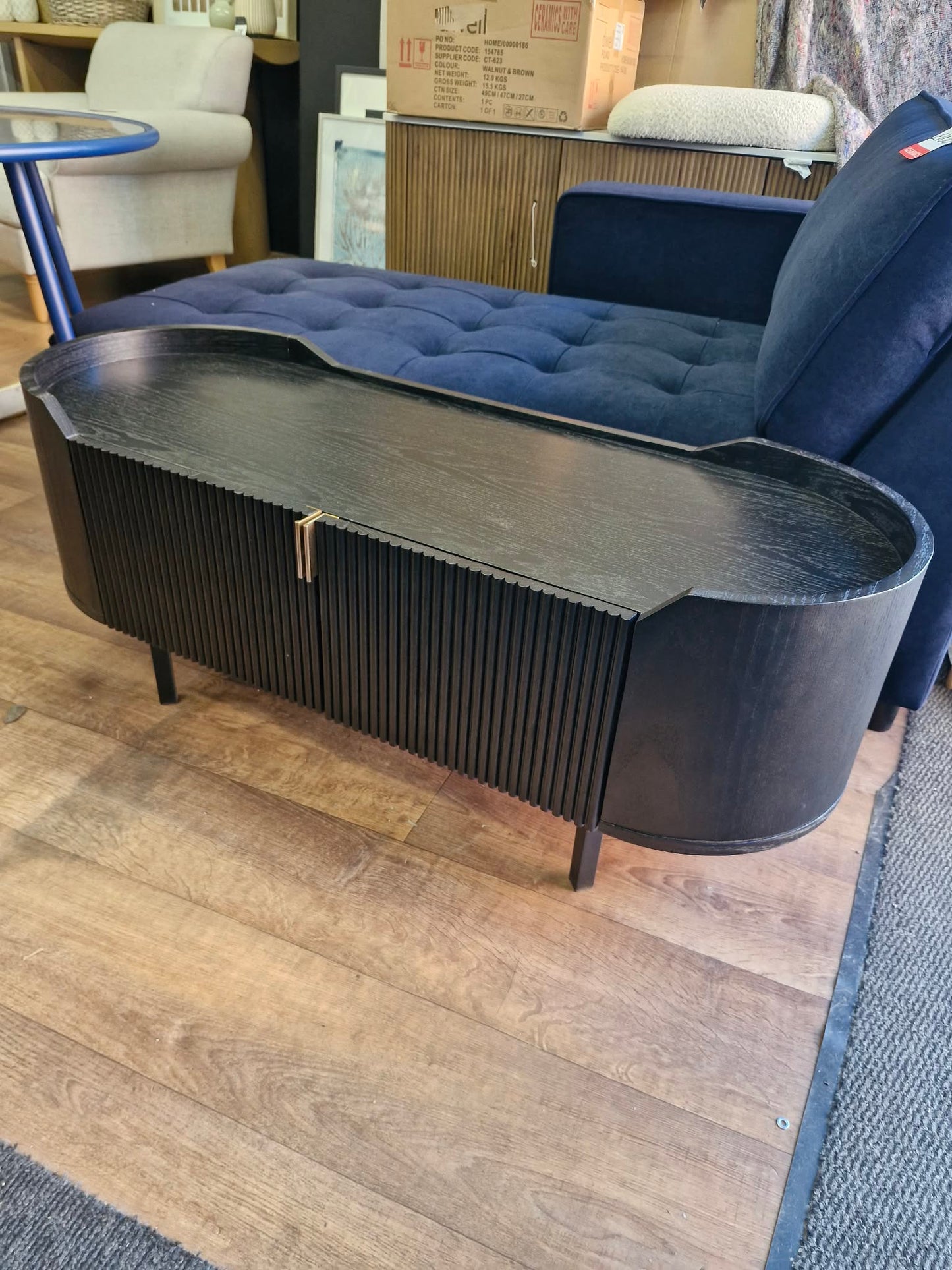 Black Oval Tv Stand Unit with ribbed front