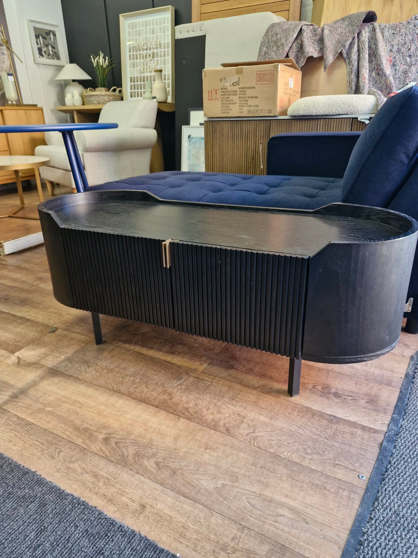 Black Oval Tv Stand Unit with ribbed front