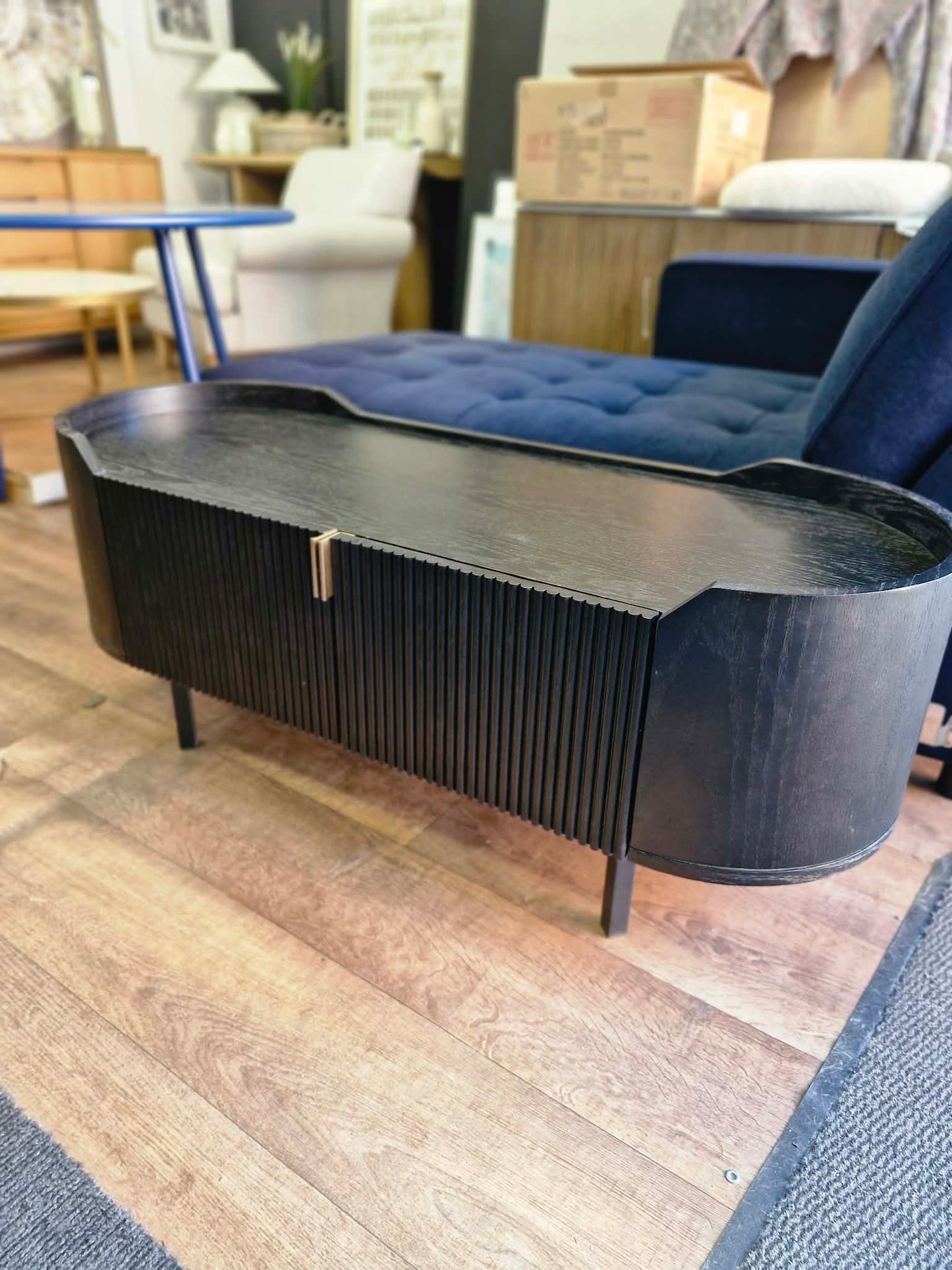 Black Oval Tv Stand Unit with ribbed front
